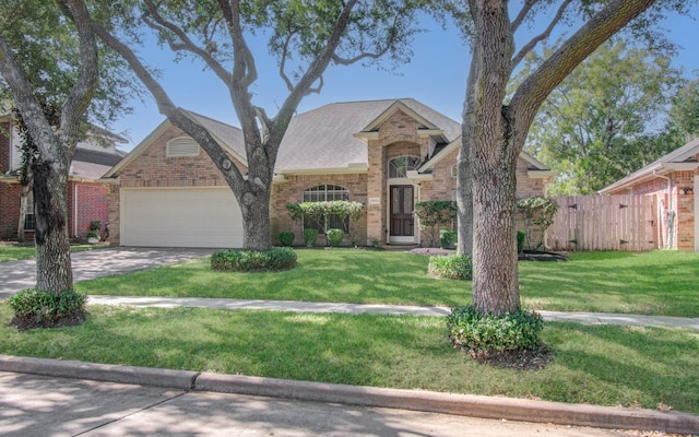 view of front facade featuring a front yard and a garage