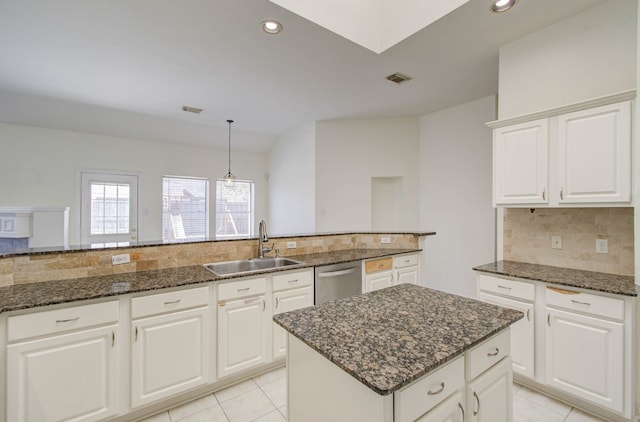 kitchen with white cabinetry, dishwasher, sink, pendant lighting, and a center island