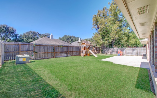 view of yard featuring a patio area and a playground