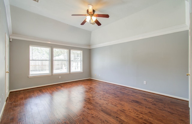 spare room with crown molding, vaulted ceiling, ceiling fan, and dark hardwood / wood-style flooring