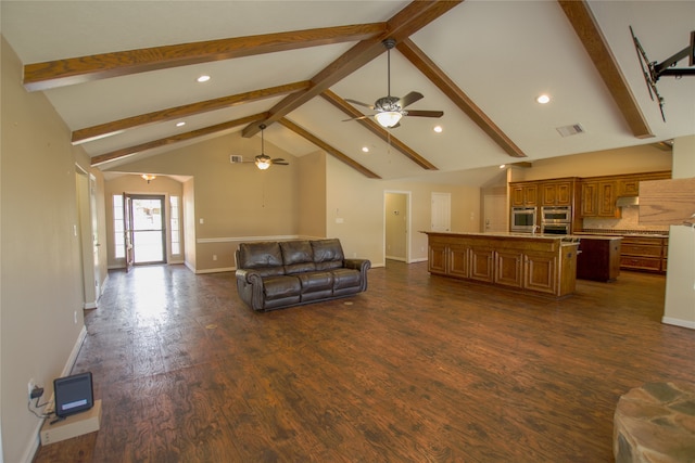 living room with dark hardwood / wood-style floors, ceiling fan, beam ceiling, and high vaulted ceiling