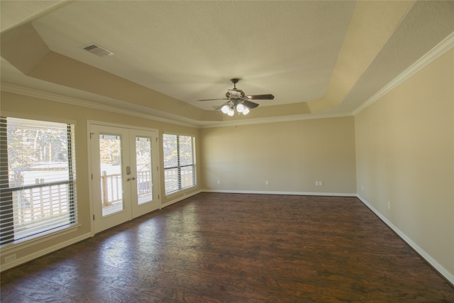 unfurnished room with dark hardwood / wood-style flooring, a tray ceiling, french doors, and ceiling fan