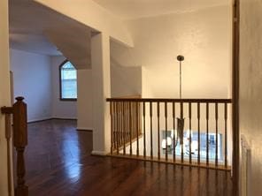 additional living space featuring dark hardwood / wood-style floors