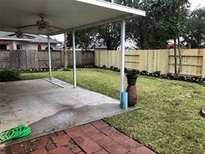 view of yard featuring a patio and ceiling fan