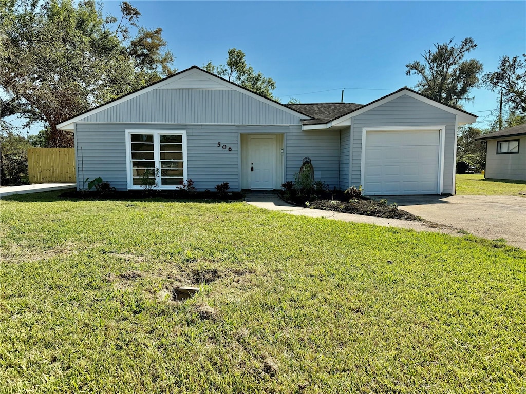 506 Center Way, St, Lake Jackson, TX 77566 - ranch-style home featuring concrete driveway, an attached garage, fence, and a front yard