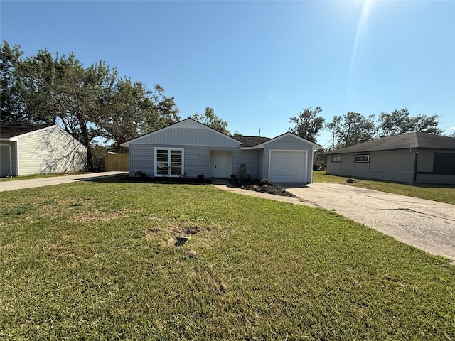 ranch-style house featuring a front yard and a garage