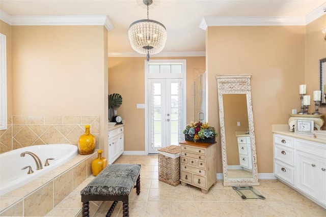 bathroom with vanity, a notable chandelier, ornamental molding, and independent shower and bath