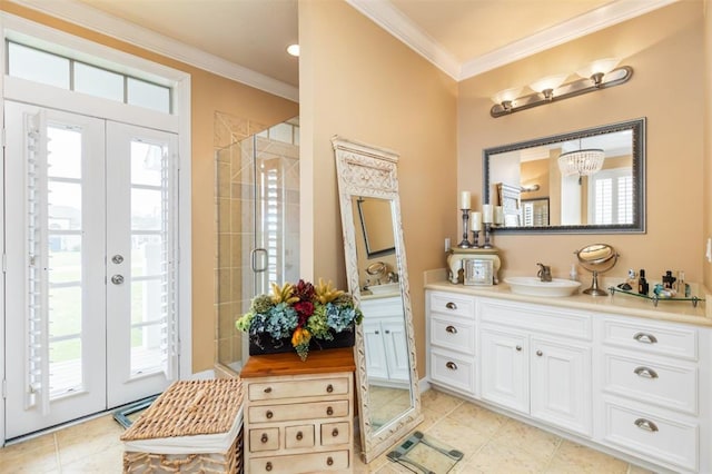 bathroom with french doors, tile patterned flooring, a shower with shower door, ornamental molding, and vanity