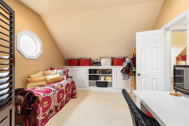 bedroom featuring light carpet and vaulted ceiling