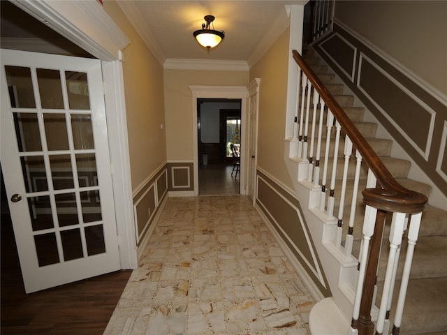 doorway featuring crown molding and hardwood / wood-style floors