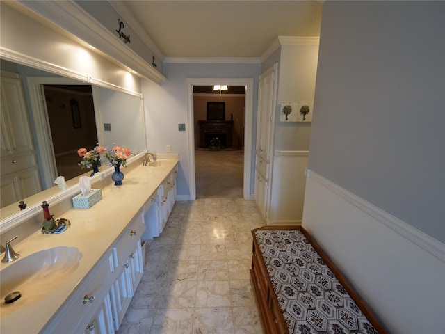 bathroom featuring vanity and ornamental molding