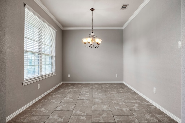 spare room featuring an inviting chandelier, ornamental molding, and plenty of natural light