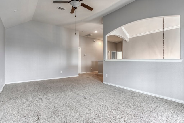 carpeted empty room featuring ceiling fan and vaulted ceiling