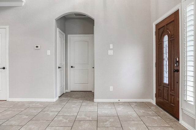 entryway with light tile patterned flooring