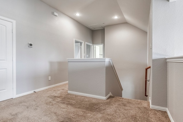 interior space with carpet flooring and lofted ceiling