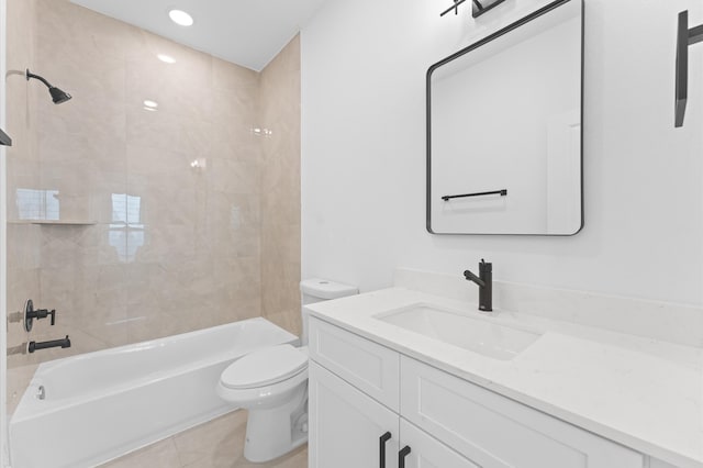 full bathroom featuring vanity, tile patterned floors, tiled shower / bath combo, and toilet