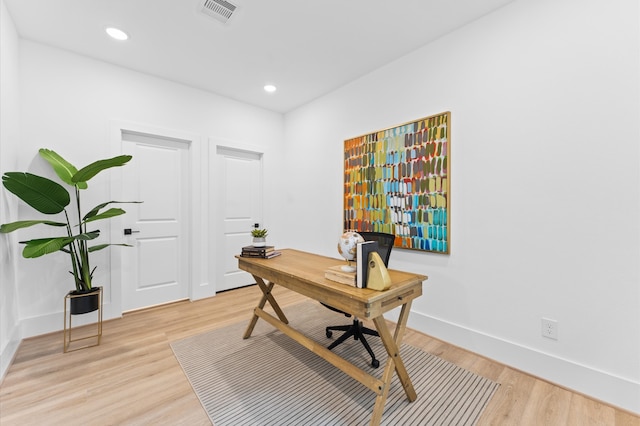 home office with light wood-type flooring