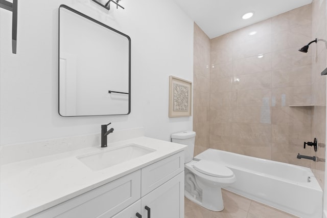 full bathroom with tile patterned floors, vanity, toilet, and tiled shower / bath