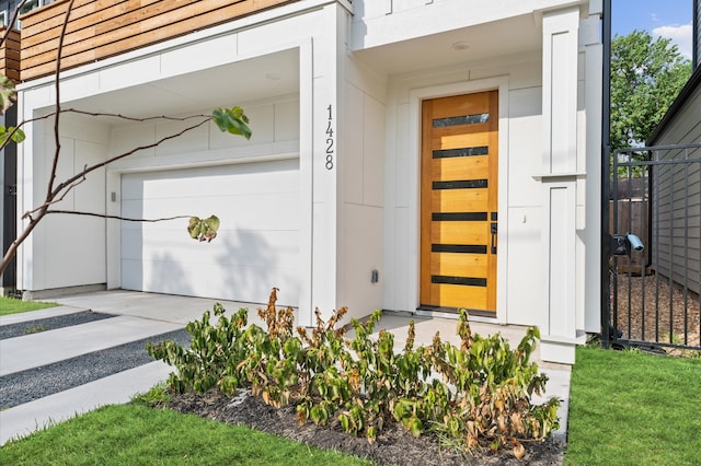 doorway to property featuring a garage