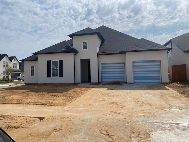 view of front of property featuring a garage