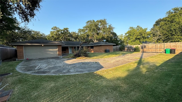 exterior space with a garage and a front lawn