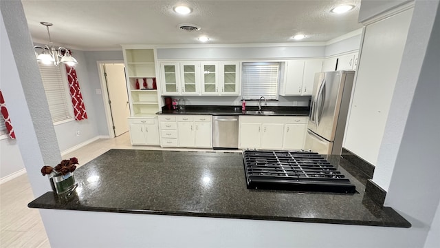 kitchen featuring ornamental molding, sink, appliances with stainless steel finishes, and white cabinetry