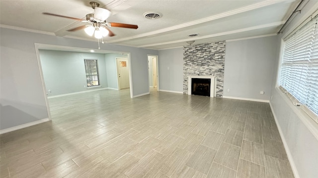 unfurnished living room with light hardwood / wood-style floors, crown molding, a tile fireplace, and ceiling fan