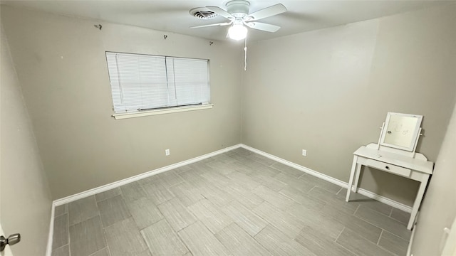 spare room with ceiling fan