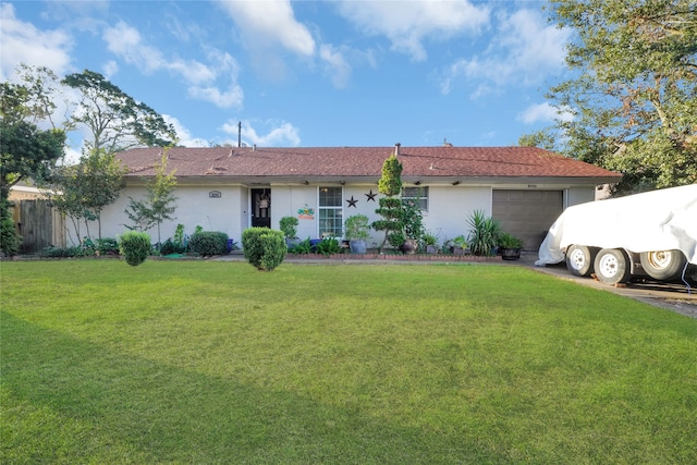 ranch-style house with a front lawn and a garage