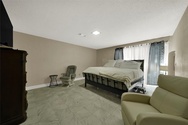 bedroom with a textured ceiling