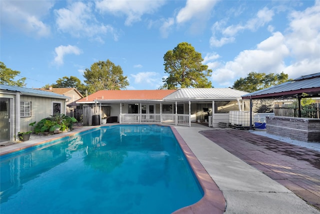 view of pool featuring a patio