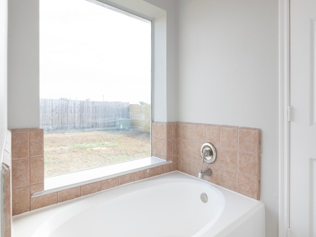 bathroom featuring a tub to relax in