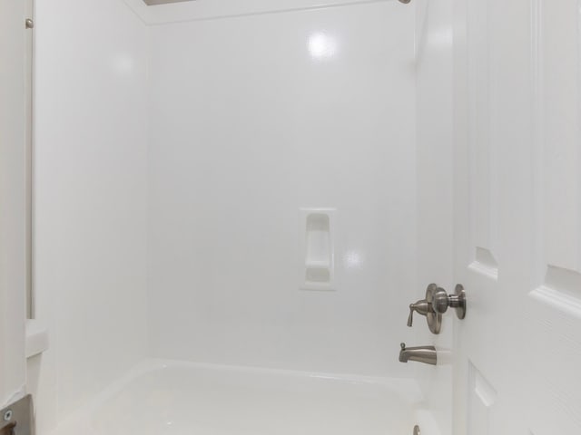 bathroom featuring  shower combination