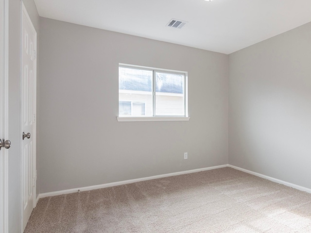 unfurnished room featuring carpet floors