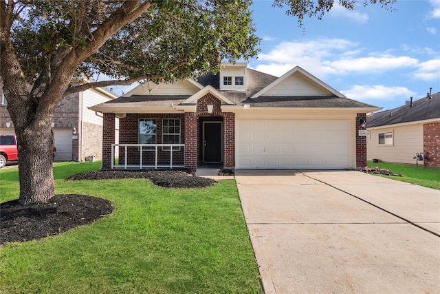 view of front of house featuring covered porch, a garage, and a front lawn