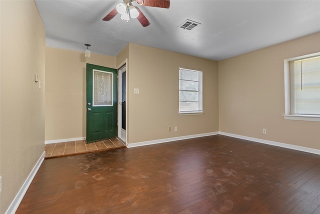 foyer with dark wood-type flooring and ceiling fan