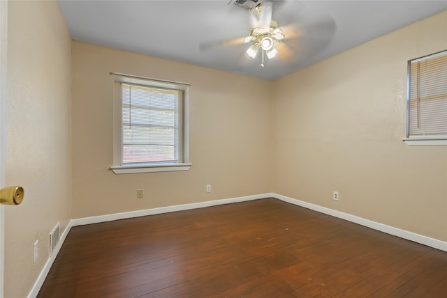 unfurnished room with dark wood-type flooring and ceiling fan