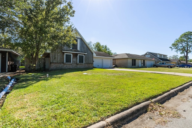 view of front facade with a front yard and a garage