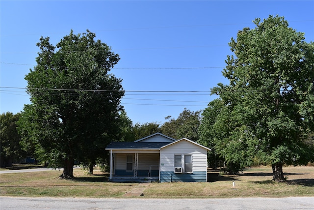 bungalow-style home with cooling unit