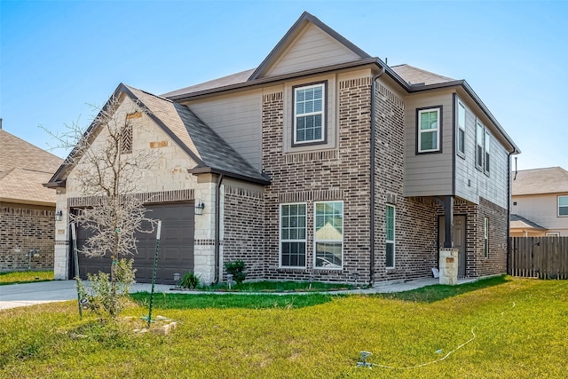 view of front of home featuring a front yard and a garage