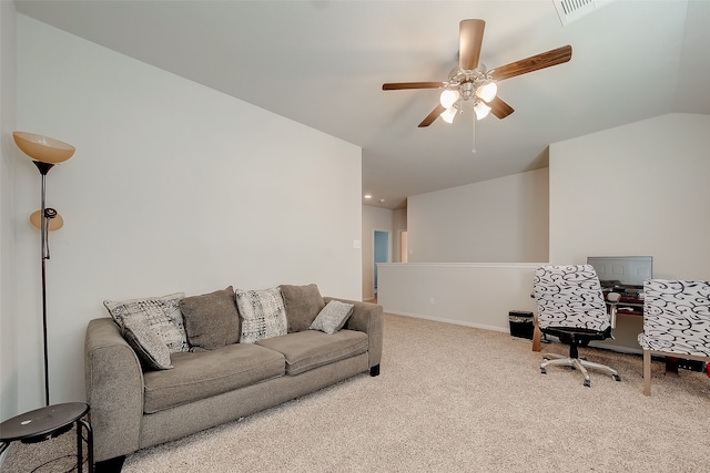 living room featuring carpet floors, ceiling fan, and vaulted ceiling