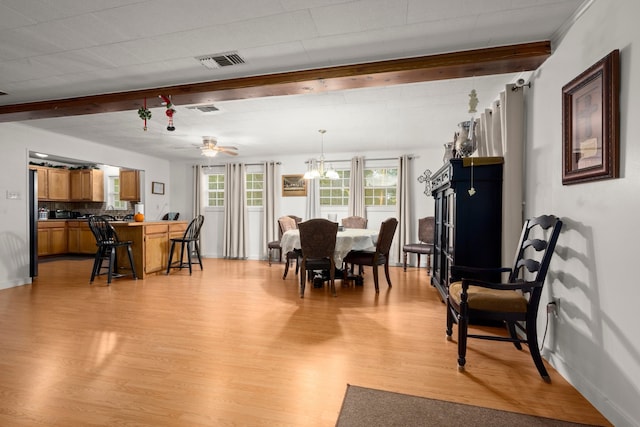 dining area with light hardwood / wood-style floors, beam ceiling, and ceiling fan with notable chandelier