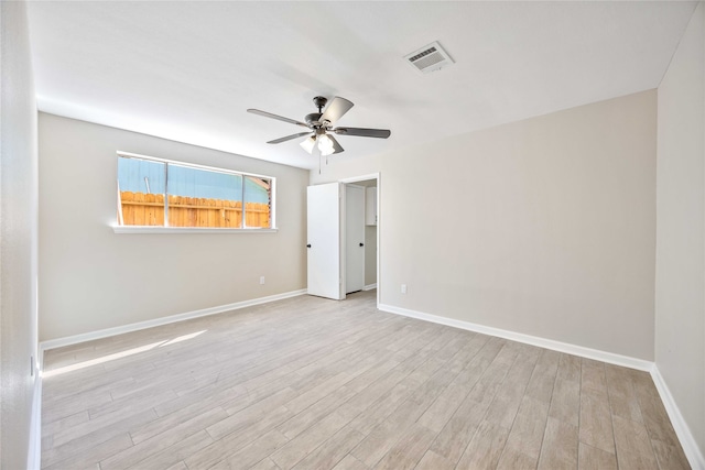 unfurnished room with light wood-type flooring and ceiling fan