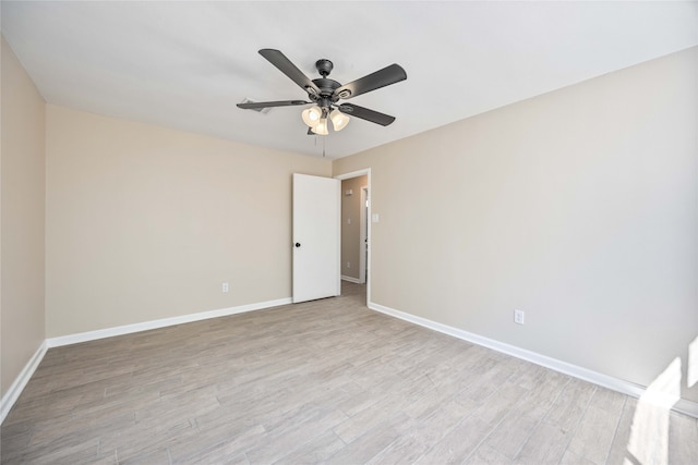 empty room with light wood-type flooring and ceiling fan