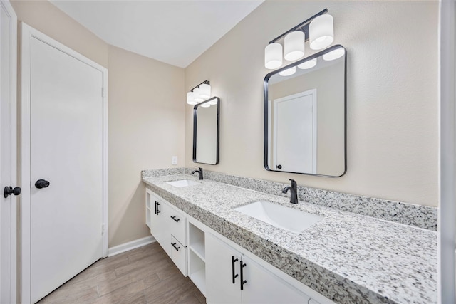 bathroom with vanity and hardwood / wood-style floors