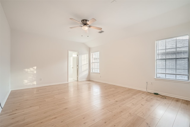 unfurnished room featuring lofted ceiling, light wood-type flooring, and ceiling fan