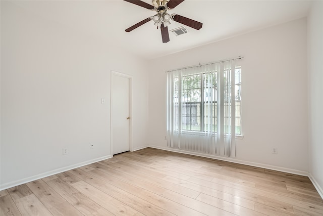 spare room with light hardwood / wood-style floors and ceiling fan