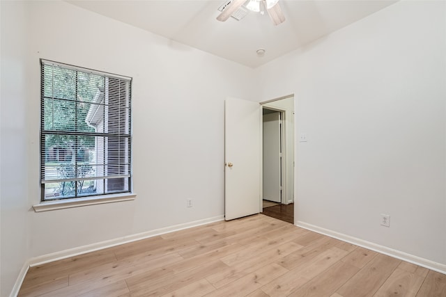 unfurnished room with light hardwood / wood-style flooring and ceiling fan