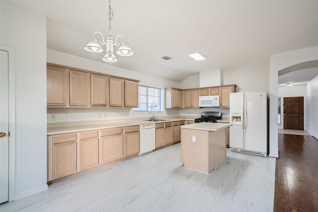 kitchen with lofted ceiling, a kitchen island, white appliances, sink, and light hardwood / wood-style floors