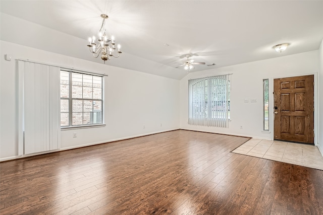 foyer entrance with light wood-type flooring and ceiling fan with notable chandelier